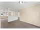 Living room featuring carpet flooring and an opening view into another space at 7613 Suwannee Ct, Jonesboro, GA 30236