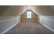 Finished attic space with carpet, window, and paneled wall at 85 Providence Pkwy, Covington, GA 30014