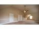 Large finished attic with carpeted floors, neutral walls, and ceiling fan at 85 Providence Pkwy, Covington, GA 30014