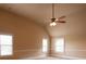 Bright attic offers carpeted flooring, neutral paint, and a ceiling fan at 85 Providence Pkwy, Covington, GA 30014