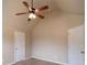 Well-lit bedroom with neutral walls and ceiling fan at 85 Providence Pkwy, Covington, GA 30014