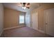 Bedroom with two doors, neutral walls, carpeted floor and one window at 85 Providence Pkwy, Covington, GA 30014