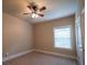 Bedroom with neutral walls, carpeted floor, one window and door at 85 Providence Pkwy, Covington, GA 30014