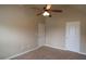 Bedroom with ceiling fan, two doors, and one window at 85 Providence Pkwy, Covington, GA 30014