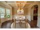 Dining room featuring a coffered ceiling, wainscotting, and ample natural light at 85 Providence Pkwy, Covington, GA 30014