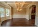 Dining room featuring a coffered ceiling, wainscotting, and ample natural light at 85 Providence Pkwy, Covington, GA 30014