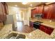 Kitchen area with stainless steel sink, granite countertops, and stainless steel oven at 85 Providence Pkwy, Covington, GA 30014