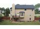 View of the home's rear exterior with a deck and patio area, perfect for outdoor entertaining at 85 Providence Pkwy, Covington, GA 30014