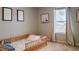 Charming room with a wooden toddler bed, soft lighting, and delightful decor, creating a cozy and playful space at 1236 Maston Rd, Auburn, GA 30011