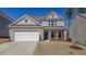 Beautiful brick front exterior showcasing the well-maintained lawn and two car garage at 1236 Maston Rd, Auburn, GA 30011