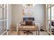 Bright home office featuring double doors, a modern desk setup, and a stylish light fixture at 1236 Maston Rd, Auburn, GA 30011