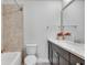 Bright bathroom featuring stylish tilework, a shower-tub combo, dark vanity and modern fixtures at 145 Laurel Crest Aly, Johns Creek, GA 30024