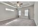 Spacious bedroom with high ceilings, large windows, and neutral wall color at 145 Laurel Crest Aly, Johns Creek, GA 30024