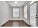 Bright bedroom featuring wood floors, large window for natural light, and neutral paint at 145 Laurel Crest Aly, Johns Creek, GA 30024