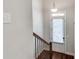 A welcoming entryway with stairs and hardwood flooring creates an inviting foyer setting at 145 Laurel Crest Aly, Johns Creek, GA 30024