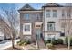 Charming brick townhome with inviting entryway and well-manicured landscaping at 145 Laurel Crest Aly, Johns Creek, GA 30024