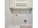 Laundry room with white cabinets, sink and washer dryer hookups at 145 Laurel Crest Aly, Johns Creek, GA 30024