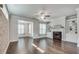 Living room with fireplace, built in shelving, hardwood floors, and lots of light at 145 Laurel Crest Aly, Johns Creek, GA 30024