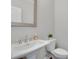 Powder room featuring white sink and commode with neutral wall color at 145 Laurel Crest Aly, Johns Creek, GA 30024