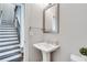 Powder room featuring white sink and commode with neutral wall color at 145 Laurel Crest Aly, Johns Creek, GA 30024