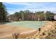 Outdoor basketball court surrounded by trees, offering a scenic view for play at 358 Woodbrook Crst, Canton, GA 30114