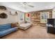 Cozy living room with decorative wood accent wall and ample natural light at 358 Woodbrook Crst, Canton, GA 30114