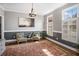 Elegant sitting room with hardwood floors, wainscoting, and ample natural light at 358 Woodbrook Crst, Canton, GA 30114