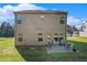 Spacious backyard with a patio area and green lawn, perfect for outdoor entertaining and relaxation at 71 Pulaski Ave, Hampton, GA 30228