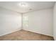 Bright bedroom featuring a single window, neutral paint, and plush carpet, creating a serene atmosphere at 71 Pulaski Ave, Hampton, GA 30228