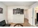 Stylish bedroom with black futon, city artwork, and neutral tones offers a modern, relaxing space at 71 Pulaski Ave, Hampton, GA 30228
