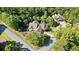 Aerial view of a beautiful home nestled among lush greenery in a peaceful, wooded neighborhood at 11 York Trce, Cartersville, GA 30121