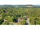 A picturesque view of a private residence surrounded by mature trees, offering a tranquil setting at 11 York Trce, Cartersville, GA 30121
