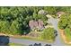 Aerial view showing a house surrounded by mature trees on a large lot with a long driveway at 11 York Trce, Cartersville, GA 30121