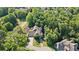 Aerial view of home with an attached garage surrounded by lush, mature trees on an expansive lot at 11 York Trce, Cartersville, GA 30121
