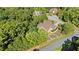 Aerial view of a house surrounded by mature trees on a large lot with a long driveway at 11 York Trce, Cartersville, GA 30121