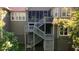 Multi-level wooden deck with stairs, screened porch, and a view of the green backyard and trees at 11 York Trce, Cartersville, GA 30121