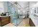 A light-filled bathroom offering a coffee bar, a glass enclosed shower, and a soaking tub at 11 York Trce, Cartersville, GA 30121