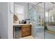 A light-filled bathroom offering a coffee bar, a glass enclosed shower, and a soaking tub at 11 York Trce, Cartersville, GA 30121