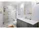 Elegant bathroom with marble tile, glass shower, and stylish vanity with gold fixtures at 11 York Trce, Cartersville, GA 30121