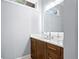 A half bathroom with a modern vanity, decorative mirror, and updated faucet and lighting at 11 York Trce, Cartersville, GA 30121