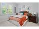 Comfortable bedroom featuring shuttered windows, carpet floors, and a wood bedframe at 11 York Trce, Cartersville, GA 30121