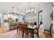 Open dining area next to kitchen and living room, featuring a contemporary chandelier at 11 York Trce, Cartersville, GA 30121