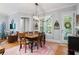 Cozy dining room featuring wood flooring, modern light fixture, and natural light at 11 York Trce, Cartersville, GA 30121