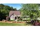 Charming stone and siding home with a beautifully landscaped yard, mature trees, and inviting curb appeal at 11 York Trce, Cartersville, GA 30121