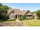 Charming exterior of a well-maintained home with stone and siding accents, a manicured lawn, and mature landscaping at 11 York Trce, Cartersville, GA 30121