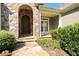 Charming front entrance with a stone archway and a beautifully landscaped walkway at 11 York Trce, Cartersville, GA 30121