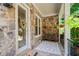 Charming front porch with stone accents, a bench, and decorative plants creating a welcoming entrance at 11 York Trce, Cartersville, GA 30121