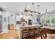 Bright, open kitchen featuring an island with seating, modern appliances, and hardwood floors at 11 York Trce, Cartersville, GA 30121