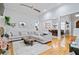 Open-concept living room leading to a dining area, featuring a comfortable sectional sofa at 11 York Trce, Cartersville, GA 30121