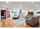 Open living room featuring hardwood floors, a staircase, and ample seating space at 11 York Trce, Cartersville, GA 30121
